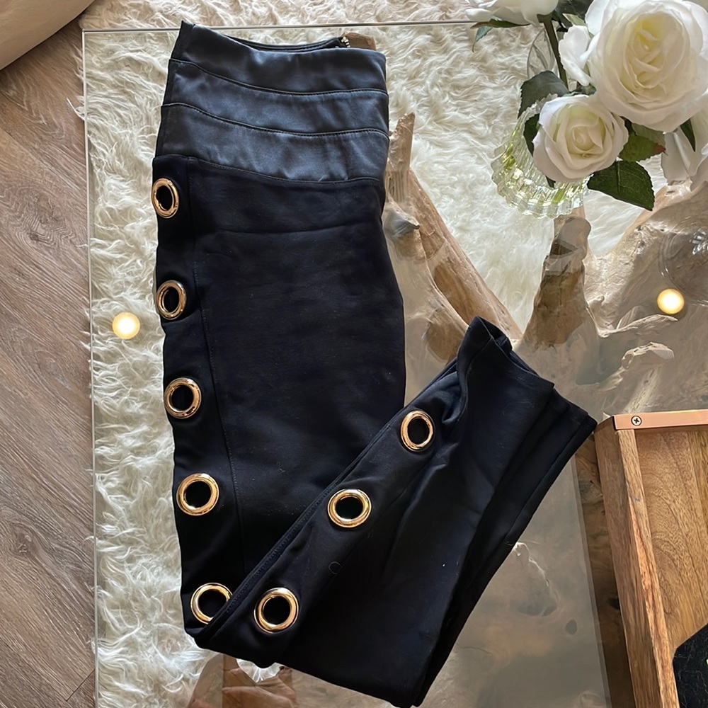 Bebe black leggings with gold rings